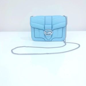 NEVER USED Coach light blue crossbody with silver hardware. Perfect condition.